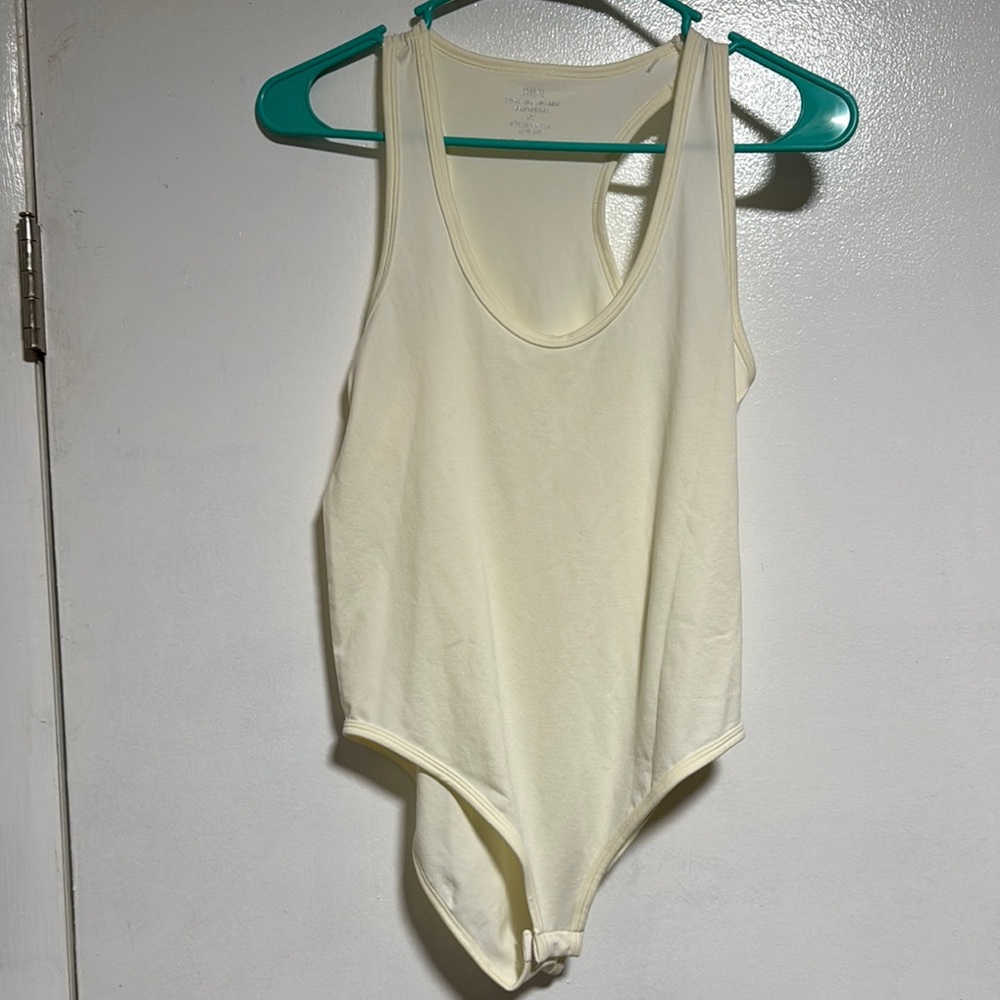 Zenana Outfitters Ivory Sleeveless Bodysuit